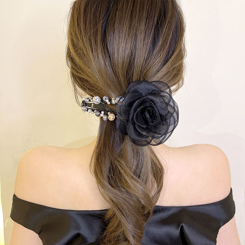 Elegant hårklips med blomster