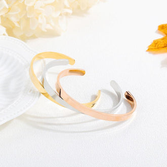 Justerbart armbånd med gravert melding