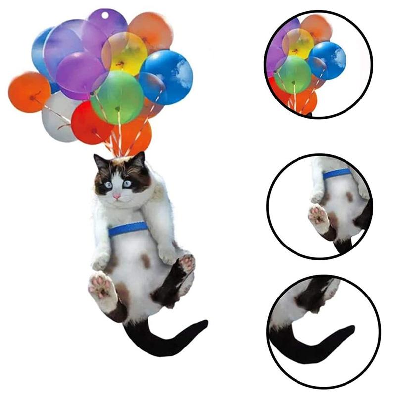 Anheng med fargerike ballonger og kattunge