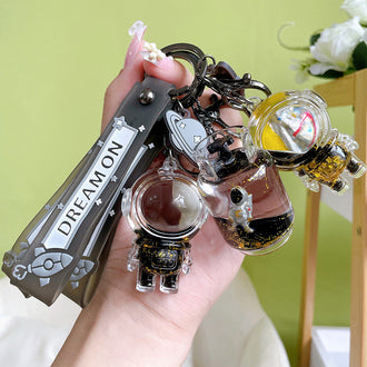 Flytende astronaut nøkkelring