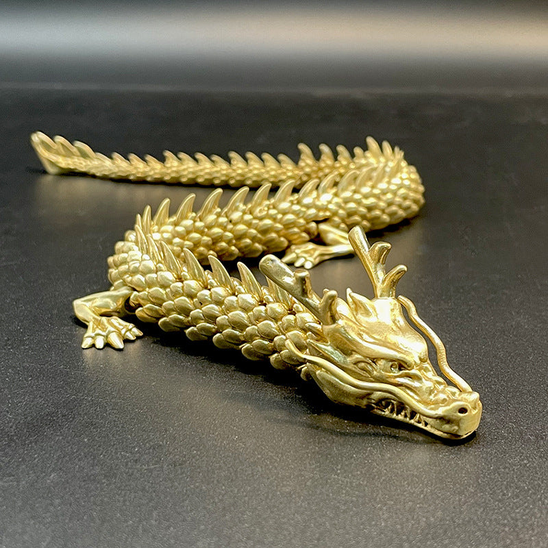 Gull-dragon med bevegelige ledd