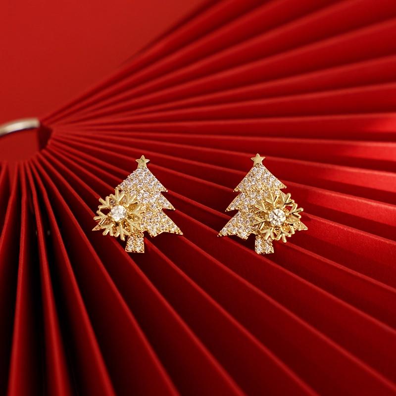 Roterende øreringer med juletre-design