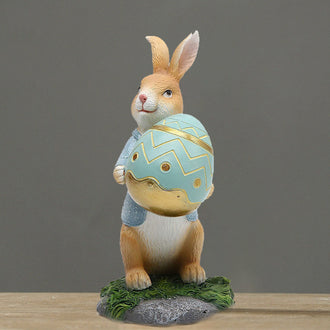 Polyresin kanin med gulrotdekorasjoner