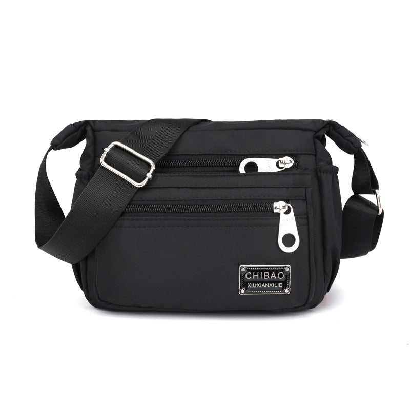 Crossbody-veske i flerlags nylon for kvinner